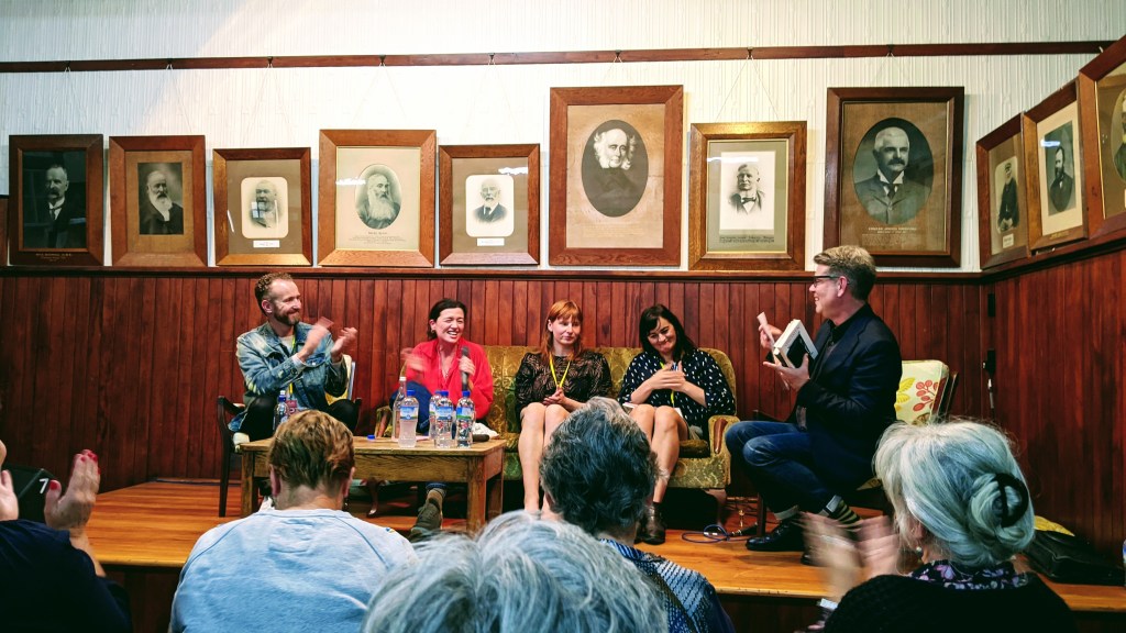Author panel discussion at Anzac Hall, Featherston, with John Campbell, Ashleigh Young, Noelle McCarthy, Madison Hamill, and Carl Shuker.