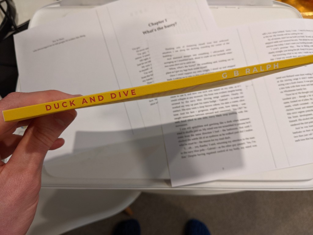 Duck and Dive paperback mockup printout on home printer. Spine.