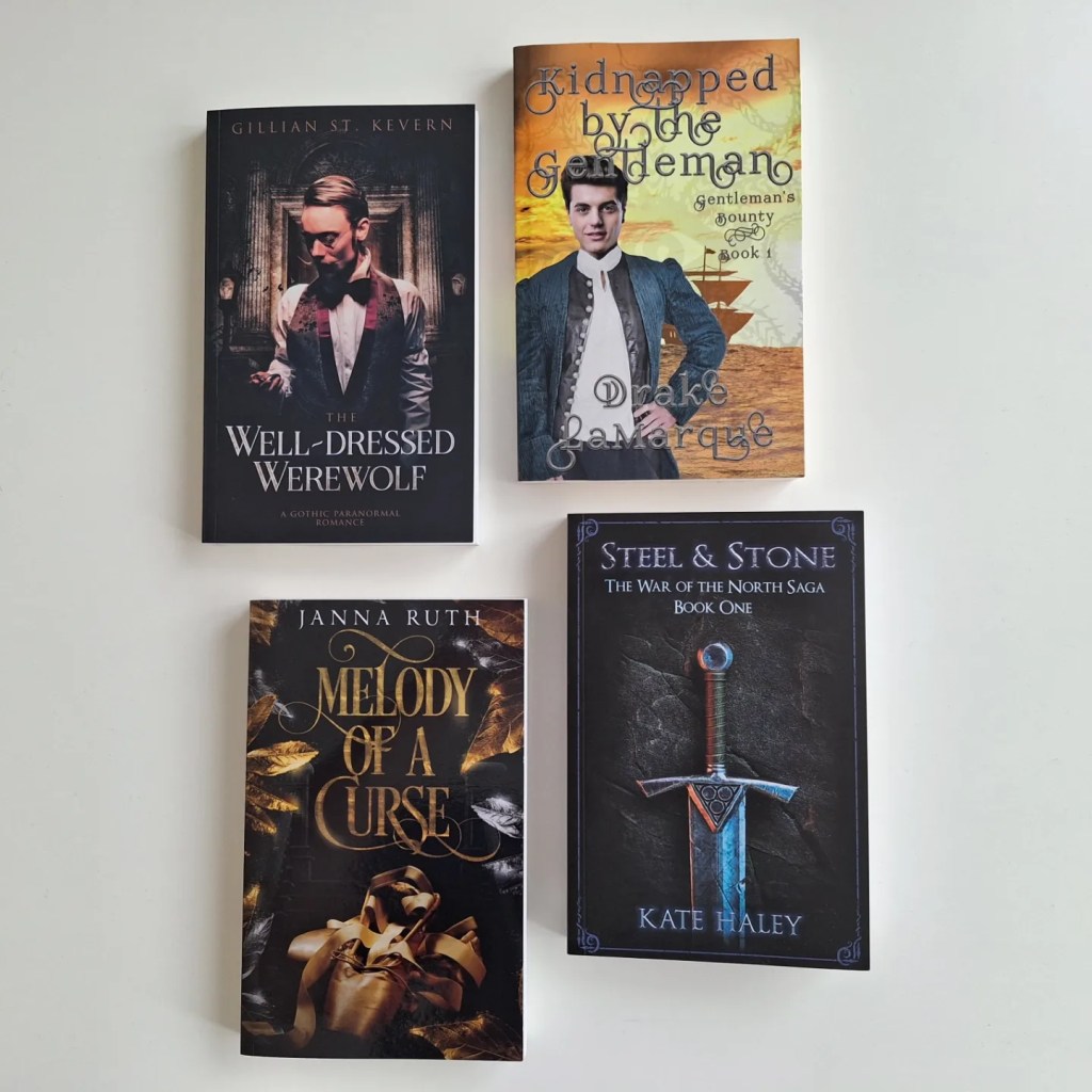 My convention book haul with four books