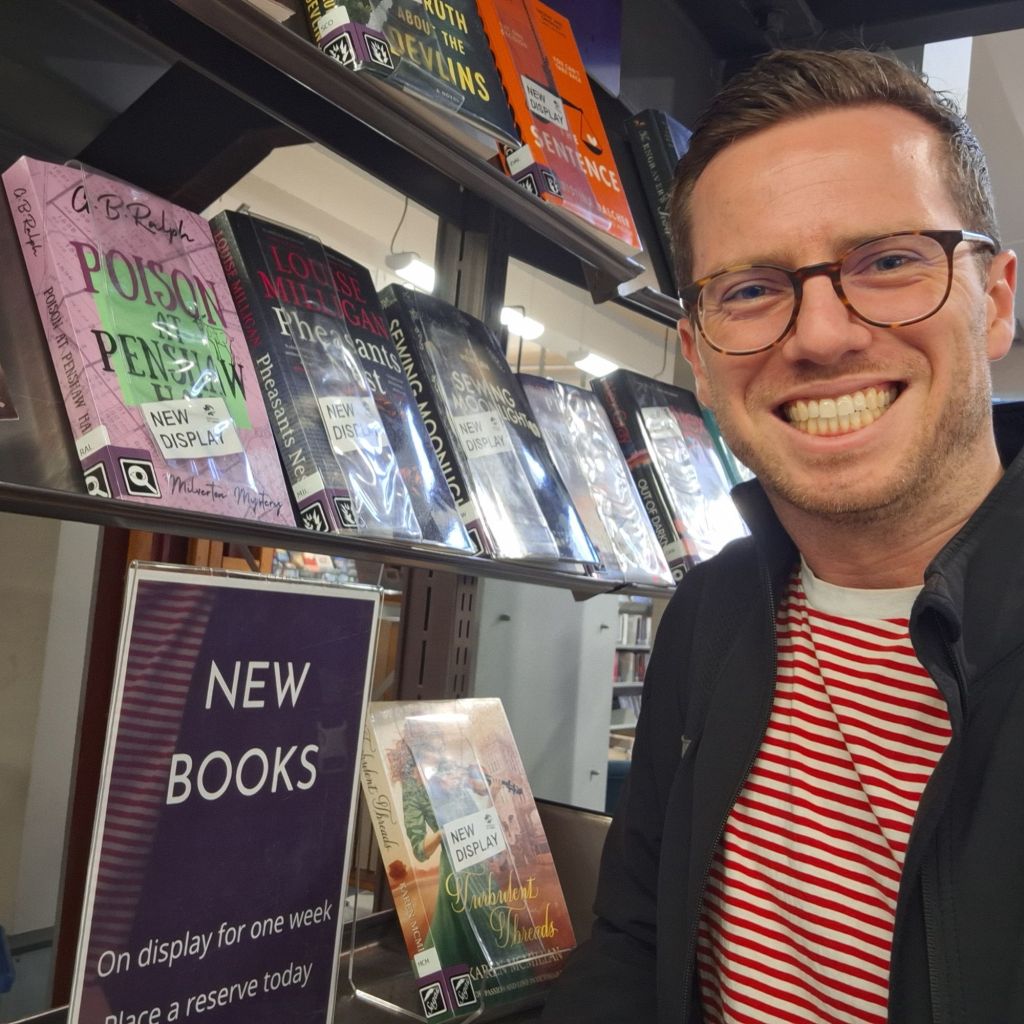 Selfie with books including Poison at Penshaw Hall by G B Ralph