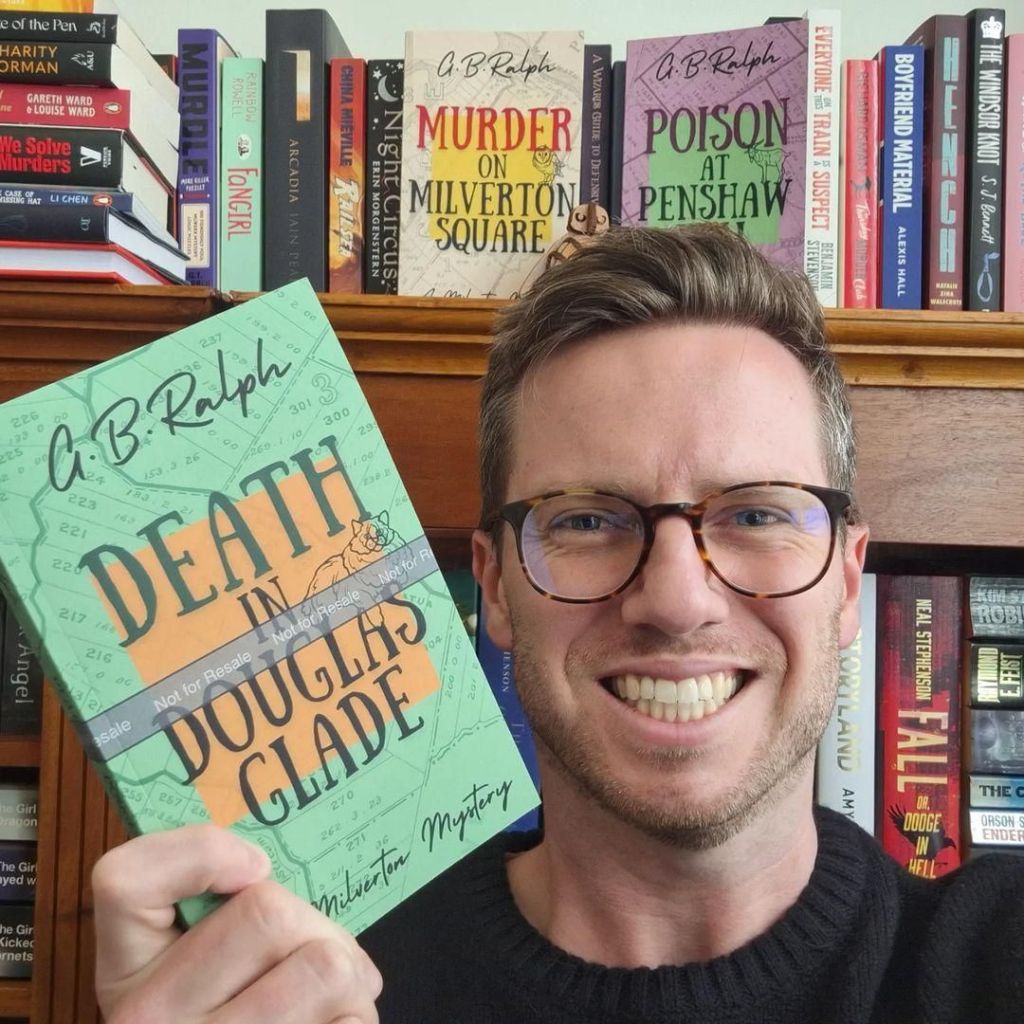 Author G B Ralph selfie with paperback proof copy of Death in Douglas Glade
