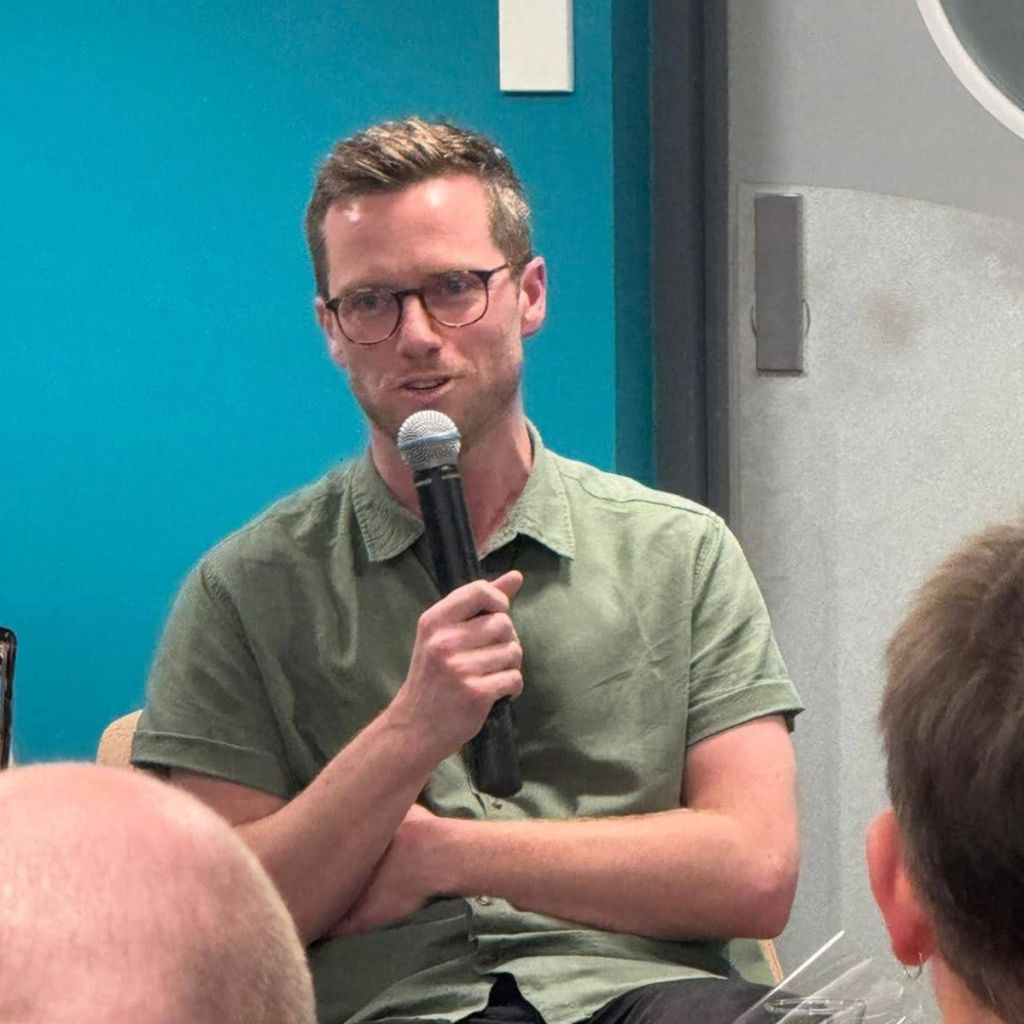 G B Ralph with microphone