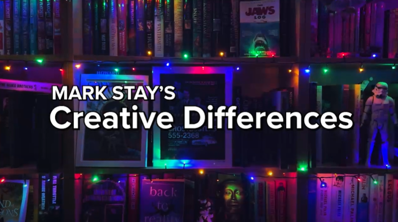 Mark Stay's Creative Differences. Title. Bookcase lined with colourful lights in the background.