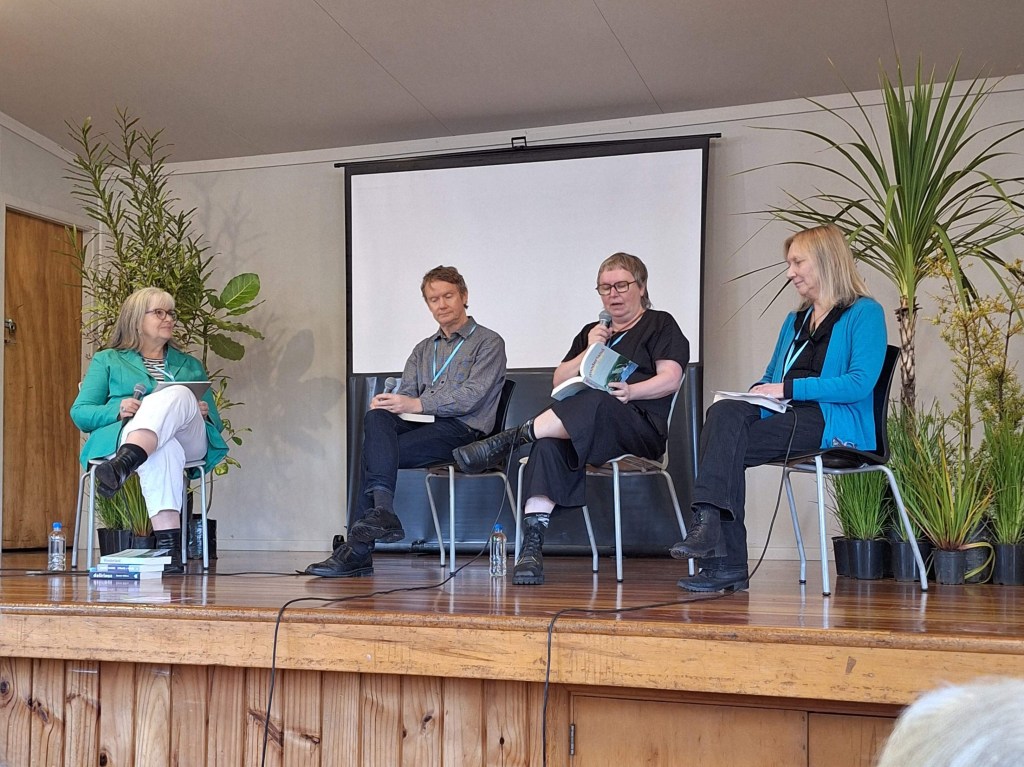 Going Coastal panel of three authors and a publisher sitting on stage
