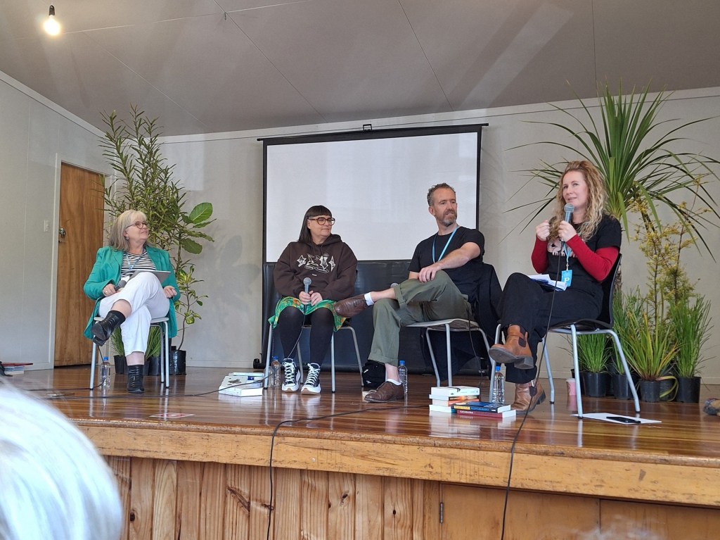 Aotearoa Over There panel of three authors and a publisher sitting on stage