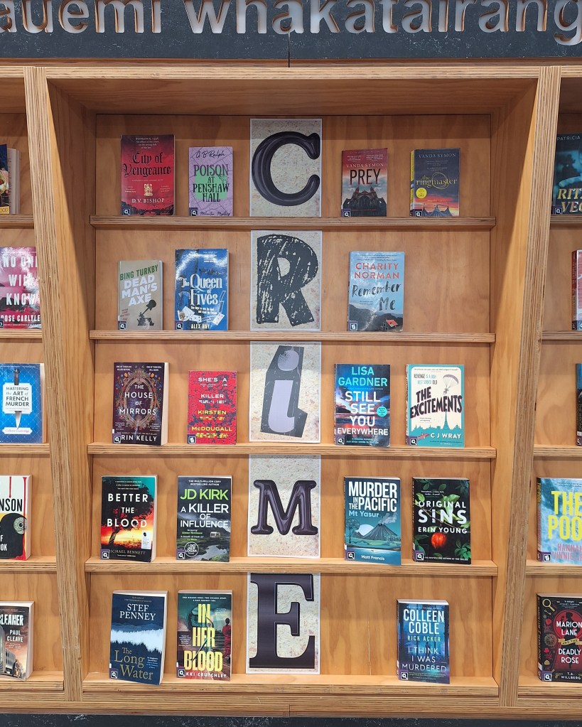 Book display wall featuring crime and mystery books