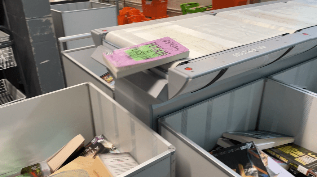 Poison at Penshaw Hall book on library conveyor belt