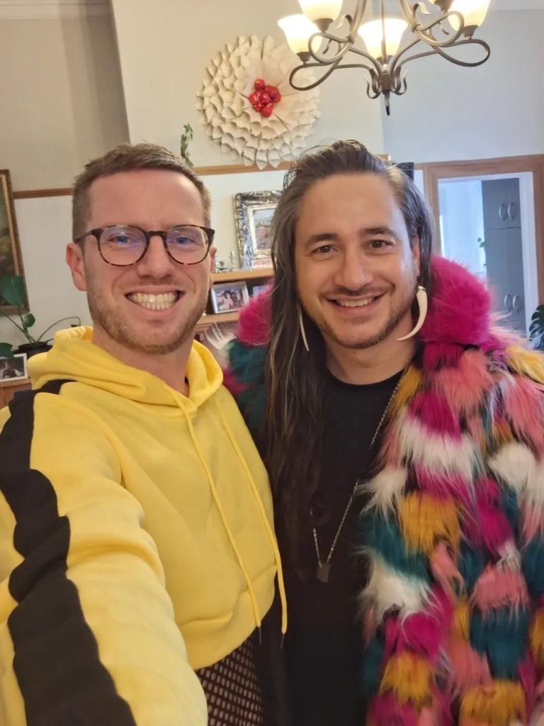 Selfie with two in colourful costumes