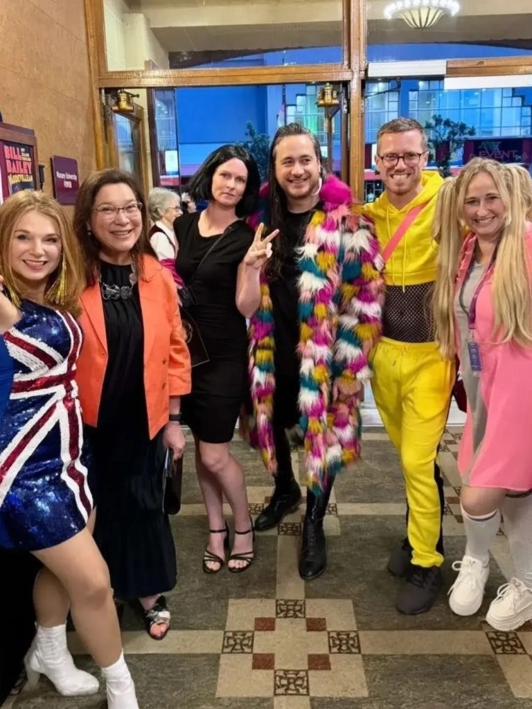 Group photo of five in Spice Girls costumes and our Deputy Mayor